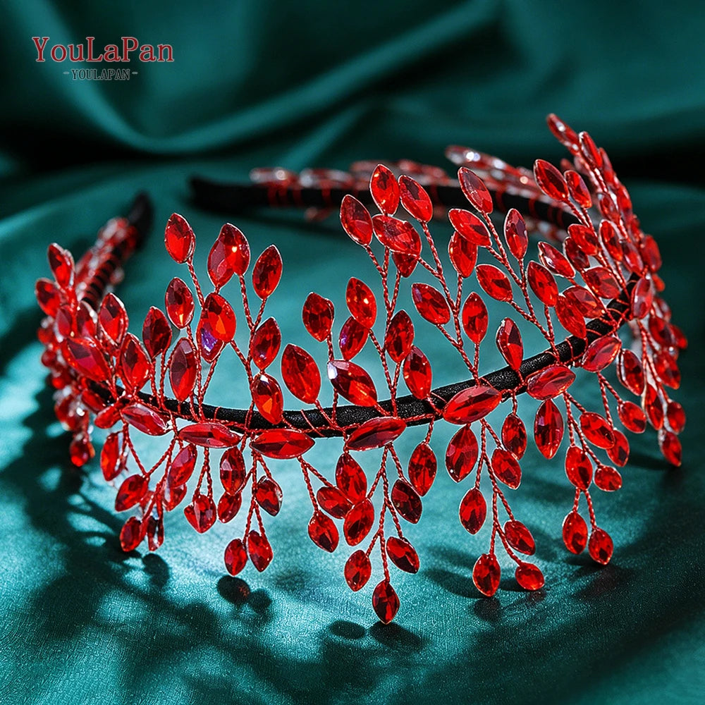A close-up of a red rhinestone bridal headband featuring delicate floral and vine designs.