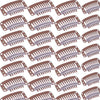 A close-up view of hair extension snap clips for wigs, showing multiple plastic clips in a light purple color.