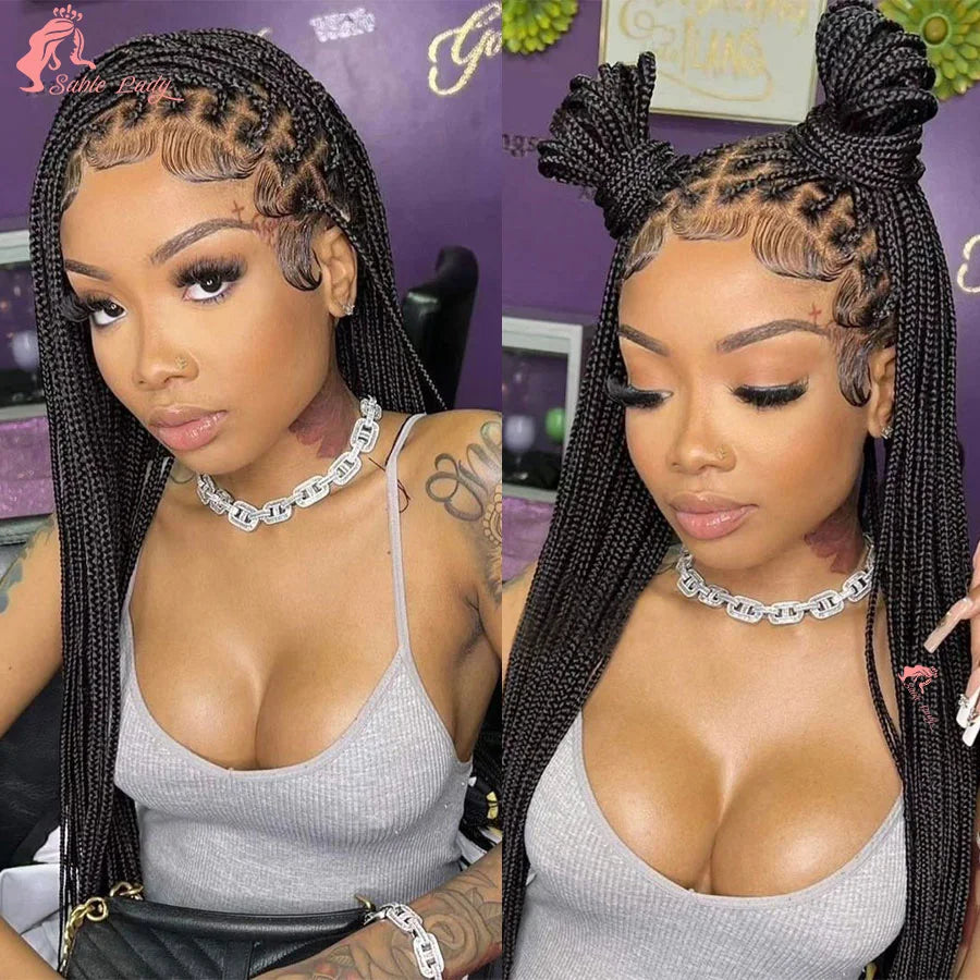 A close-up photo of a woman modeling a 36 inch full lace box braids wig with intricate parting and gold jewelry.
