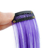 A hand holds a black hair extension bar with gold accents, showing long, straight purple synthetic hair.