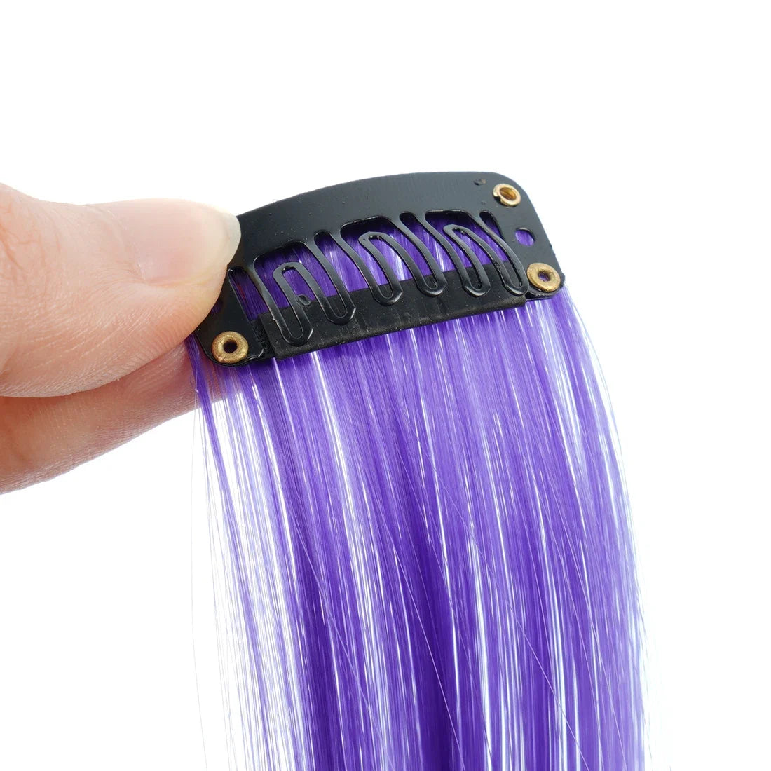 A hand holds a black hair extension bar with gold accents, showing long, straight purple synthetic hair.