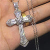 A silver-toned retro Christian cross amulet necklace with clear stones and a delicate chain.
