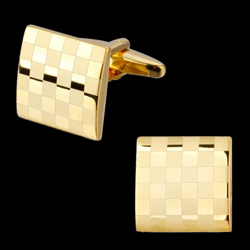 A square cufflink made of gold-toned metal with a checkered pattern.