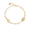 A gold plated rosary bracelet featuring a cross charm and small beads in gold, silver, and rose gold tones.