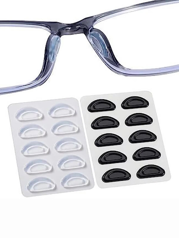 Clear silicone anti-slip nose pads for eyeglasses shown with a plastic frame and a pack of black nose pads