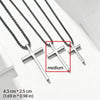 Silver stainless steel cross pendant necklace displayed on a white background.