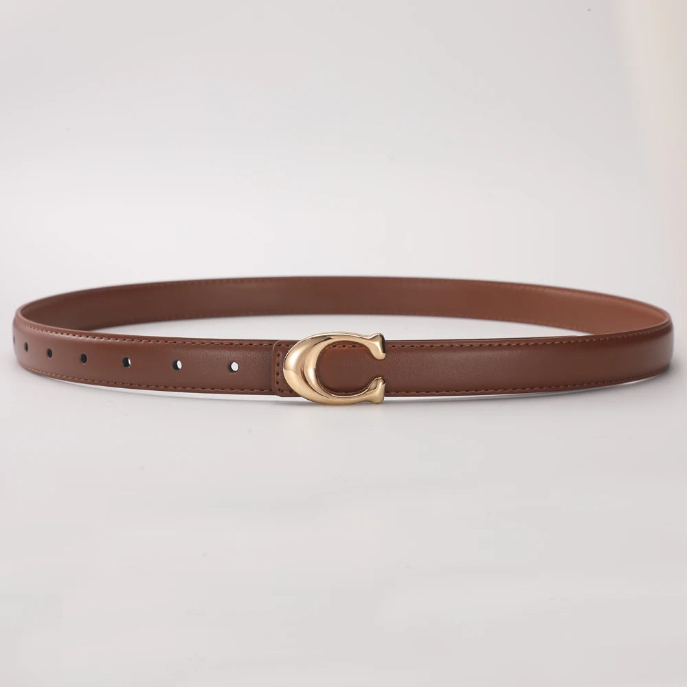 A brown leather belt with a gold C-shaped buckle lying flat on a white surface.