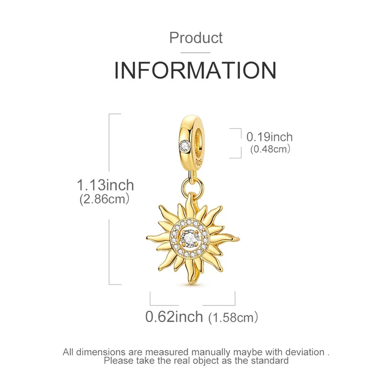 A gold-toned sun charm pendant with a circular design and rays, shown against a white background.