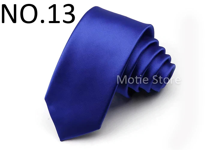 A dark blue satin neck tie folded and displayed on a white background.
