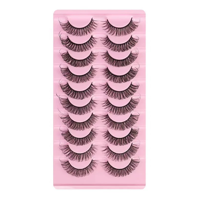 A pink plastic tray holding a set of dramatic mink false eyelashes.