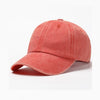 A solid coral red washed cotton snapback cap shown from the side.