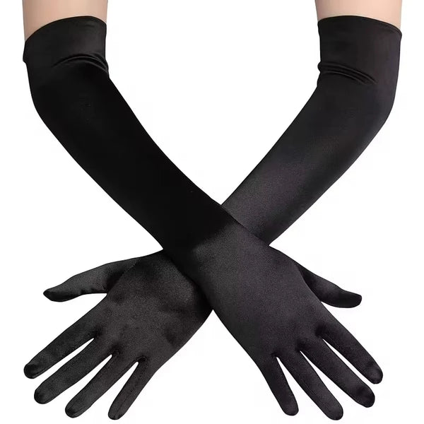 Black opera finger gloves with a vintage style, shown crossed on a hand.