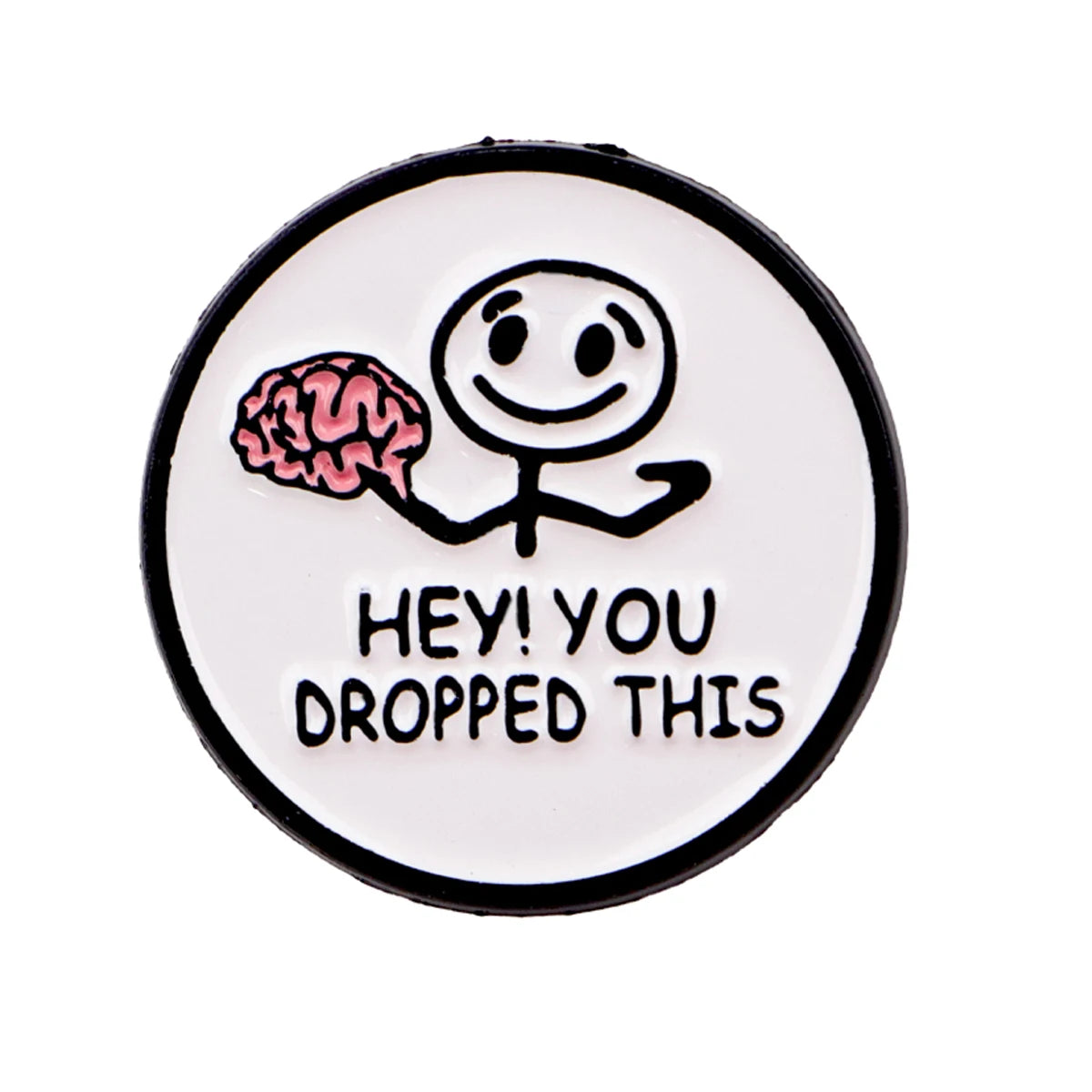 A white enamel pin featuring a simple cartoon face with a pink brain, with the text Hey you dropped this.