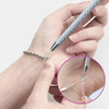 A hand holds a precision jewelry tool kit with a fine needle tip for clasps and closures.