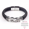 A silver and black leather knot bracelet engraved with Love My Grandson and a forever message.