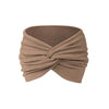 A beige fabric headband tied in a knot, suitable for yoga or sports.