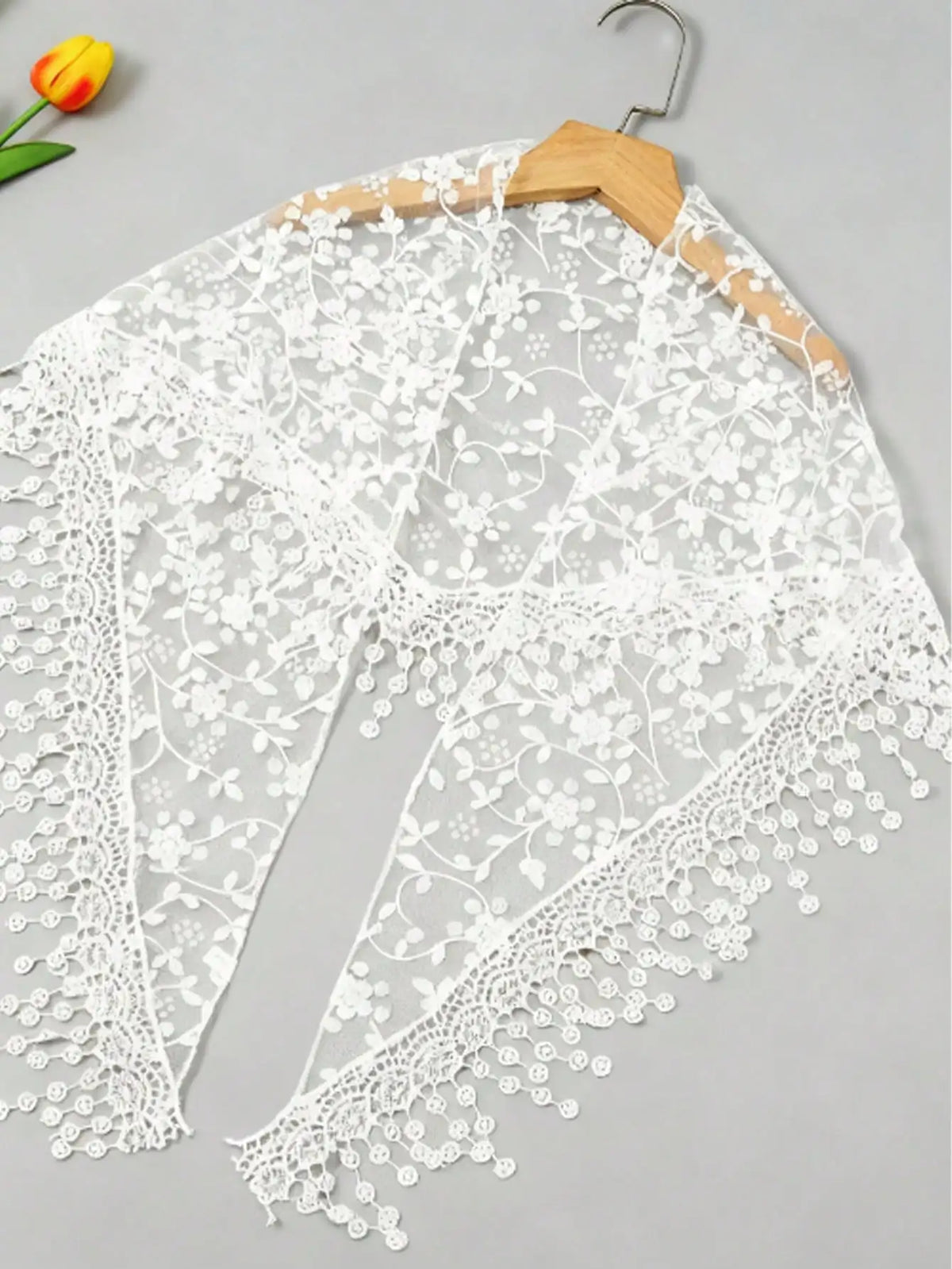 White floral lace scarf and headscarf set displayed on a wooden hanger