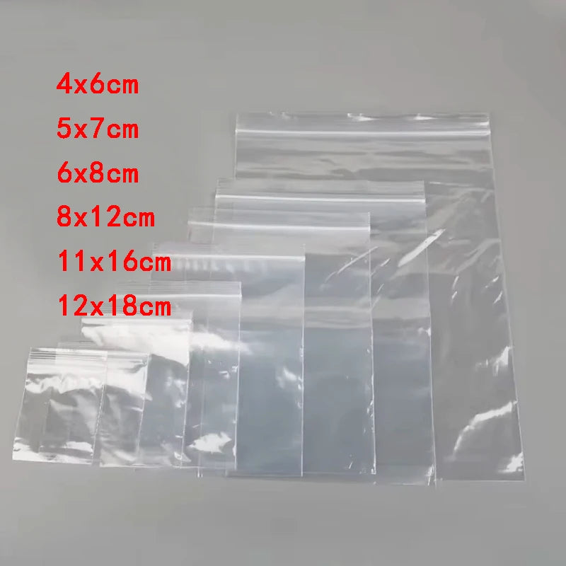 A collection of clear plastic zip lock storage bags in various sizes, including 4x6cm up to 12x18cm.