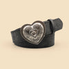 A black leather belt with a heart-shaped silver embossed buckle featuring a smaller heart design.