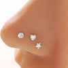 Three clear zirconia heart star stud earrings displayed on a skin-toned earlobe.