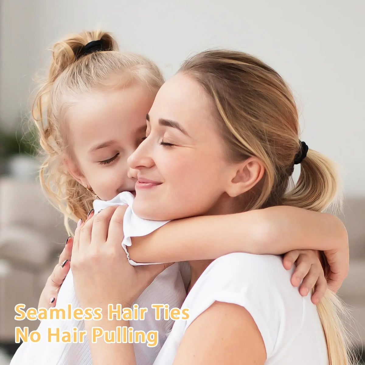 A woman gently holds a young girl's face while applying seamless hair ties to her blonde hair.
