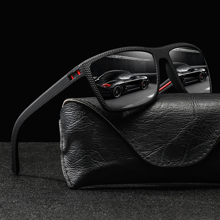 A pair of black vintage check pattern sunglasses resting on a black leather pouch.