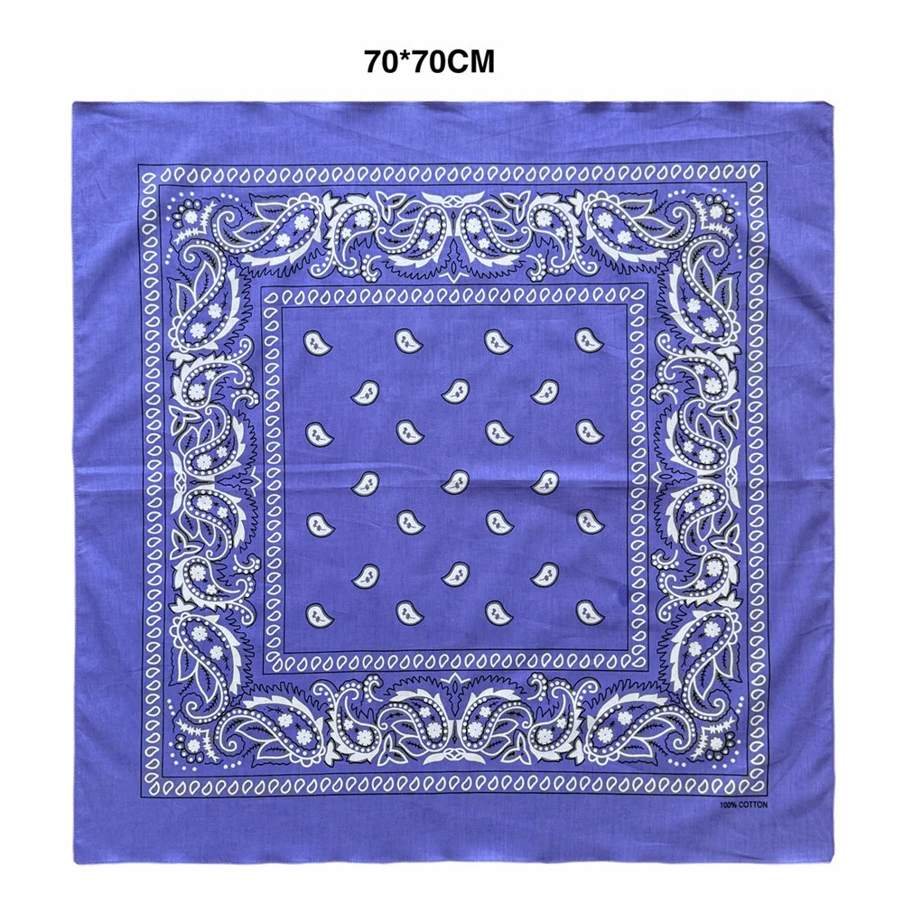 Purple cotton scarf with a blue paisley print and white floral motifs on a square fabric.