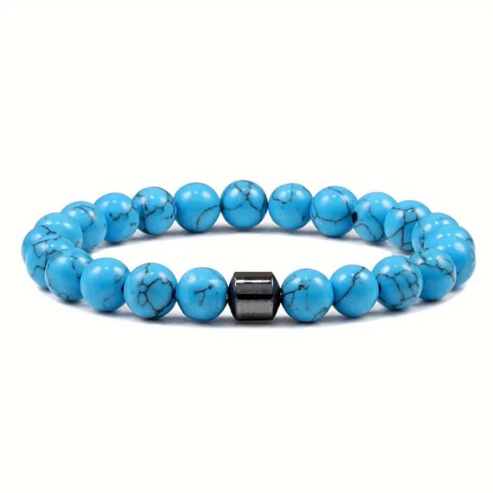 A bracelet made of polished, bright blue tiger eye lava map beads and a silver-toned clasp.
