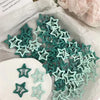 A collection of teal and mint green Y2K sweet star barrette hair clips displayed on white paper.