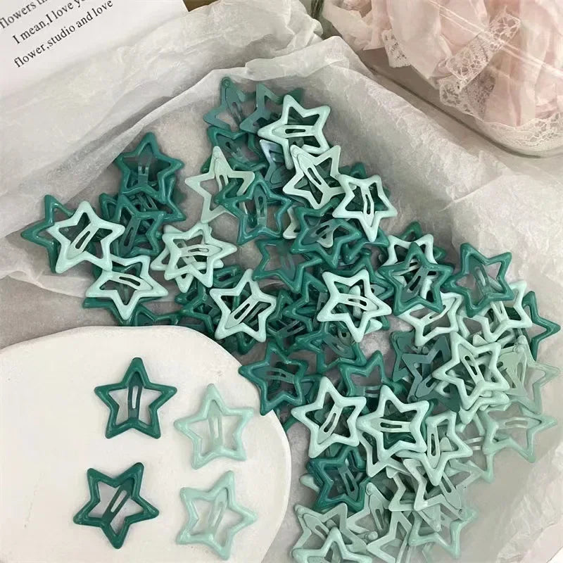 A collection of teal and mint green Y2K sweet star barrette hair clips displayed on white paper.