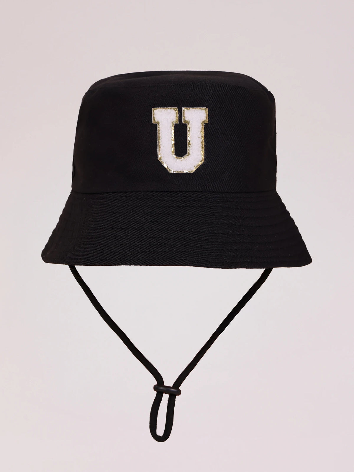 Black sun hat with a white letter U embroidered on the front and an adjustable cord.