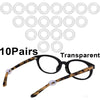 Ten pairs of transparent silicone eyeglass ear hooks and a pair of tortoiseshell eyeglasses.