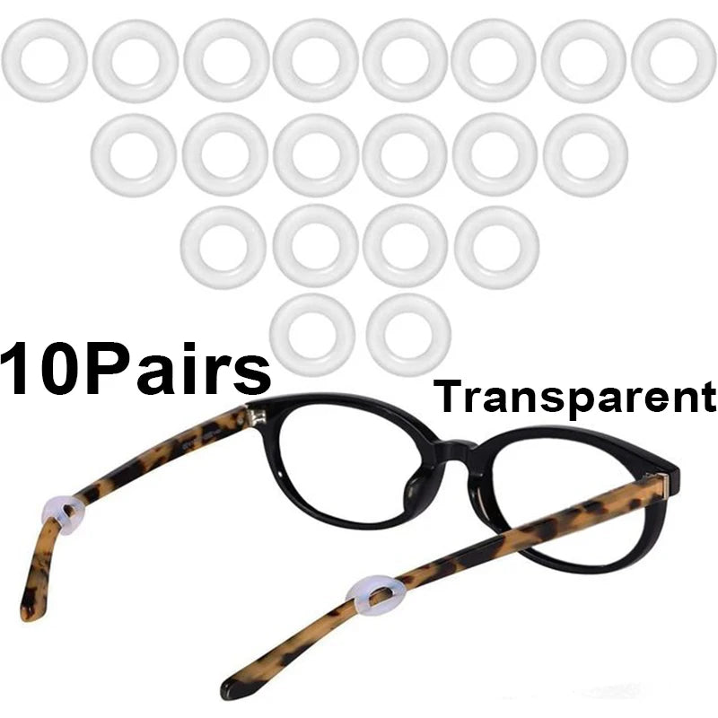 Ten pairs of transparent silicone eyeglass ear hooks and a pair of tortoiseshell eyeglasses.