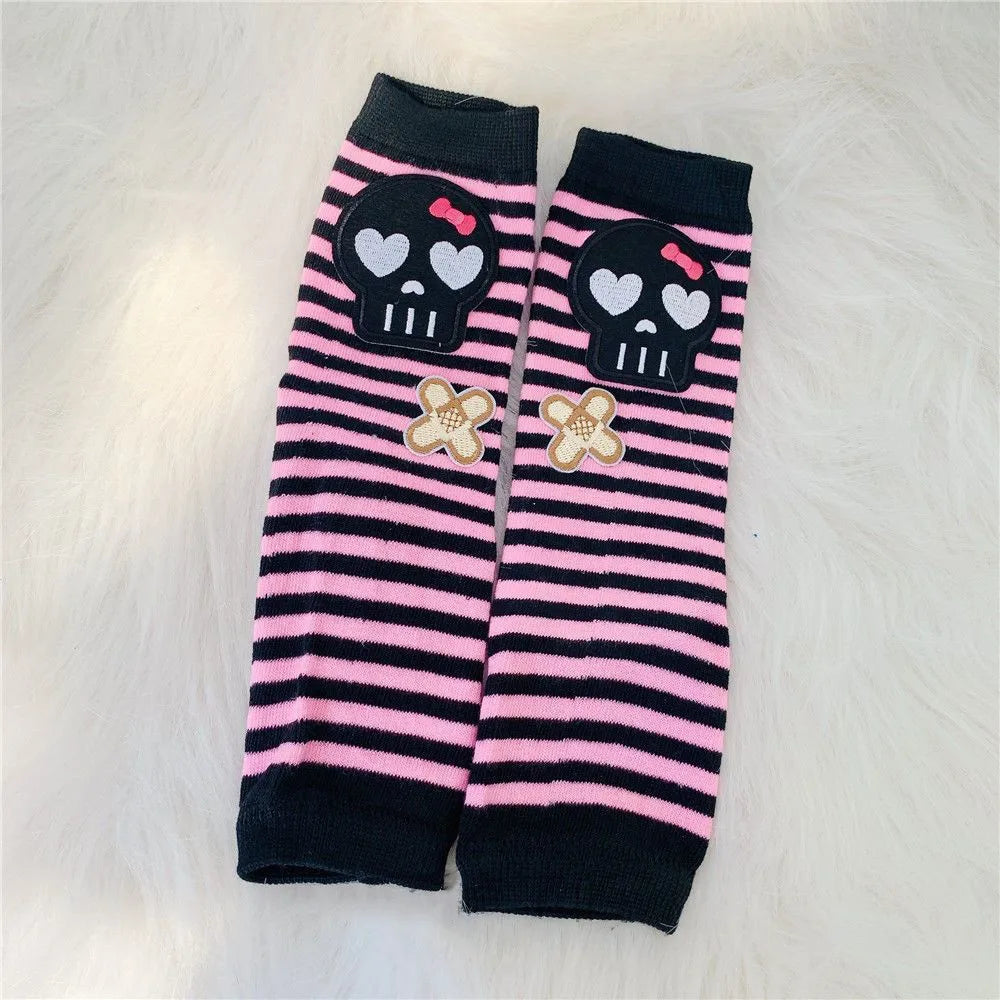 Black and pink striped fingerless socks featuring skull and flower designs
