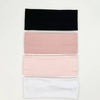 A set of four knitted hair bands in black, pink, and white.
