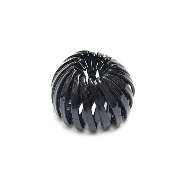 A cluster of black, glossy hair clips shaped like horsetails.