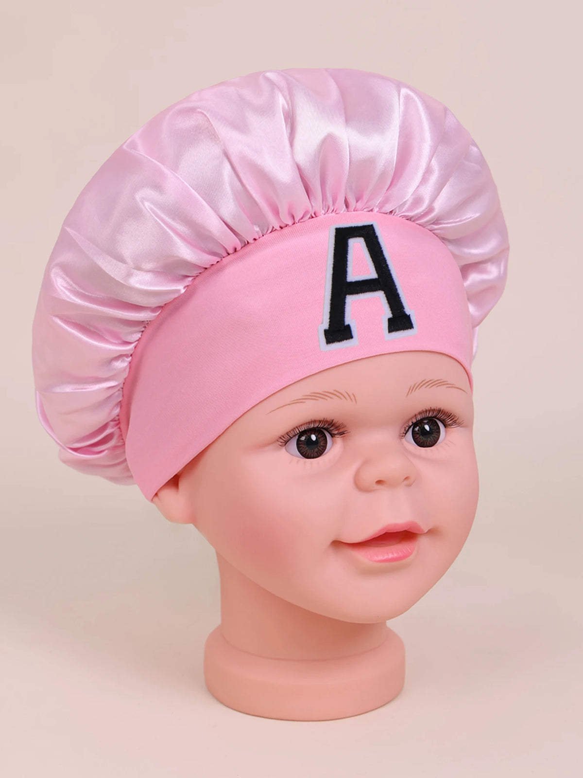 Pink A-Z letter sleep cap for kids with a satin toque