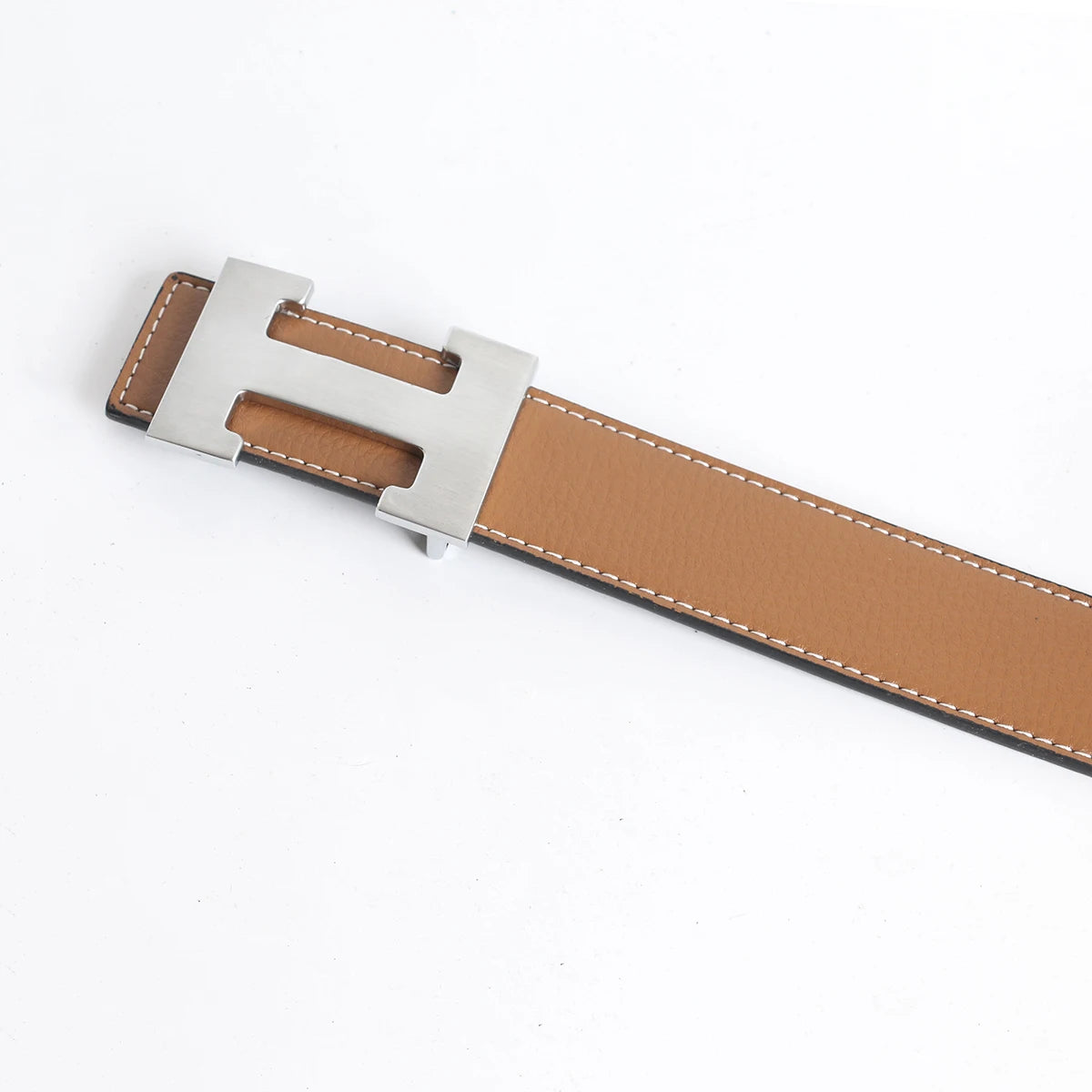 A brown genuine leather dress belt with a silver buckle shown from the side.