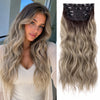 Long, wavy blonde hair with dark clips and ombre coloring displayed on a model's head.