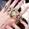 A hand holds a luxury diamond inlaid quartz wristwatch with a gold casing and intricate detailing.