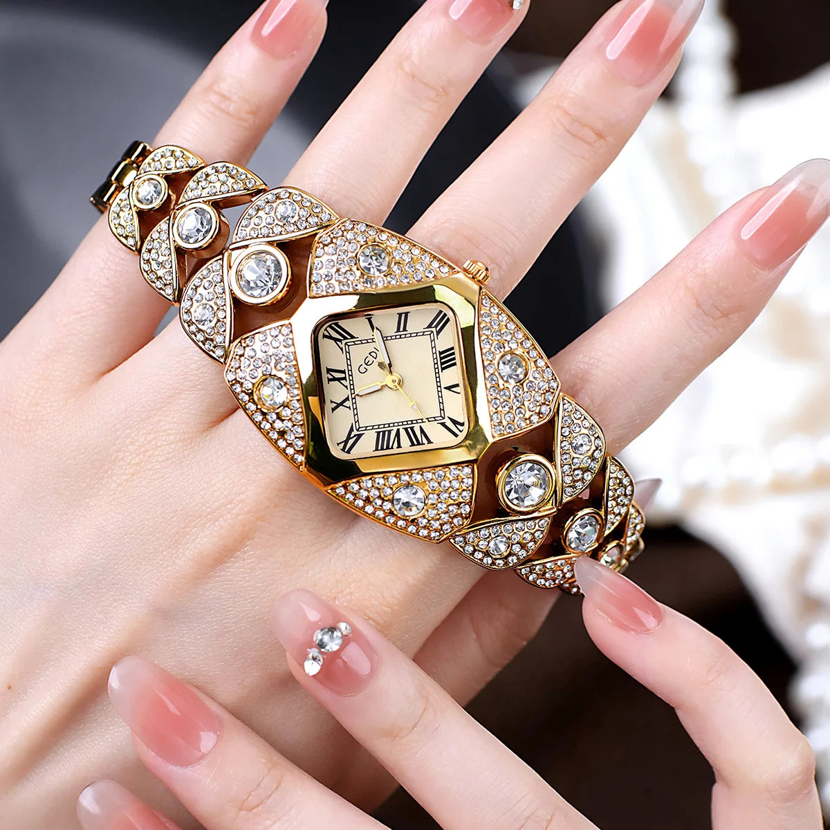 A hand holds a luxury diamond inlaid quartz wristwatch with a gold casing and intricate detailing.