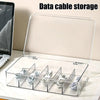 A clear plastic multi-compartment organizer for storing and organizing data cables and wires.