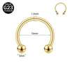 Gold-toned titanium nose ring with a curved hoop and spherical findings.