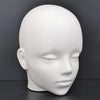 A white professional mannequin head used for practice and display.