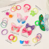 A collection of colorful butterfly hair accessories including rings, clips, and bows in pink, green, yellow, and purple.