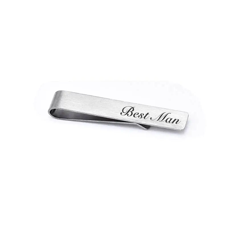 A brushed stainless steel men's tie clip engraved with the words Best Man.