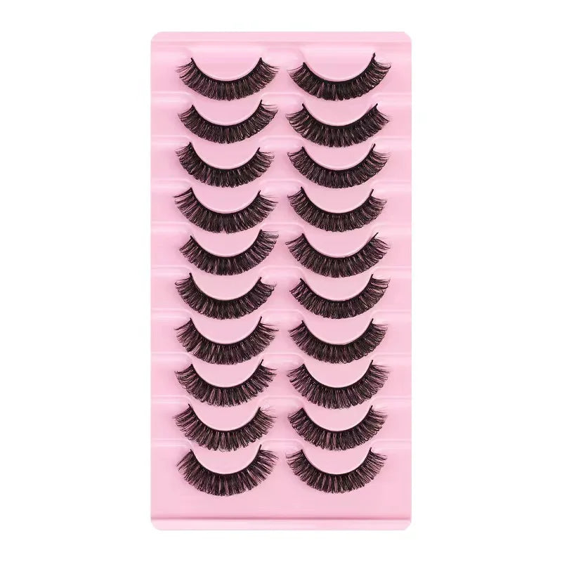 A pink plastic tray holding multiple rows of dramatic mink false eyelashes