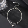 Sterling Silber Herzarmband, Zweischicht-Anklet, auf dunkler Oberfläche