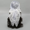 White floral embroidered lace bandana headscarf tied around dark hair