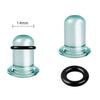 A clear glass ear stretching plug with a black ring, shown next to its separate black ring.
